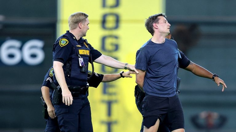 Security tackles baseball fan after he ran onto field, interrupting Astros-Orioles game