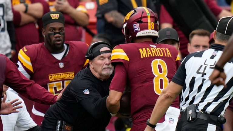 Commanders' Dan Quinn left bloodied after quarterback runs into him during play