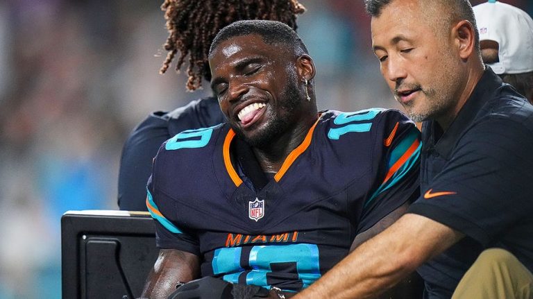 Dolphins star Tyreek Hill carted off field after gruesome knee injury, rushed to hospital