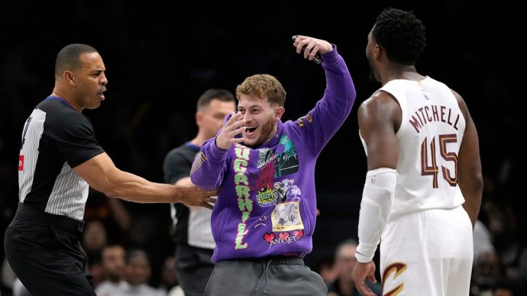 Fan storms court during NBA game seeking selfie with Cavaliers star Donovan Mitchell