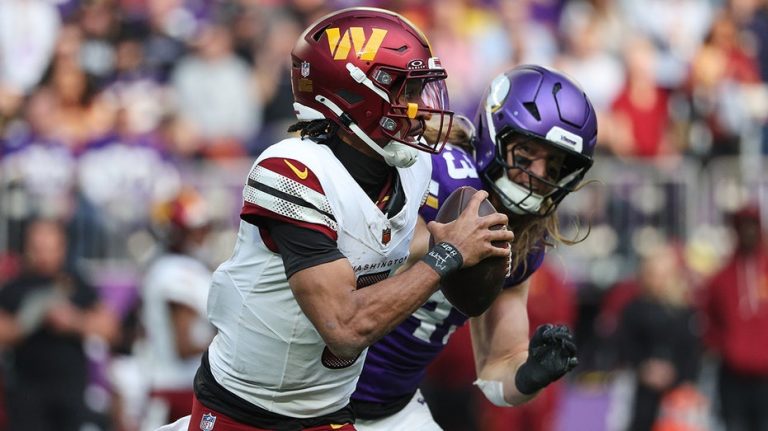 Commanders' Jayden Daniels takes hit after interception, re-injures shoulder